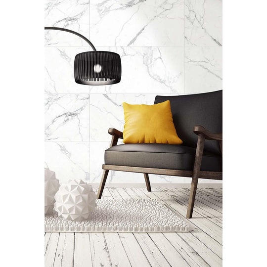 Python Ariston Porcelain Matt Tiles white marble-effect tiles with a black armchair