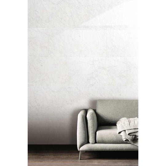 Python Carrara Porcelain Matt white marble-effect tiles with a grey sofa