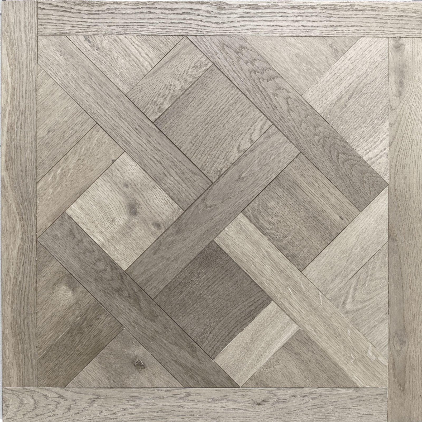 Sandringham limed oak gray oak parquet flooring featuring a herringbone pattern for elegant interior design