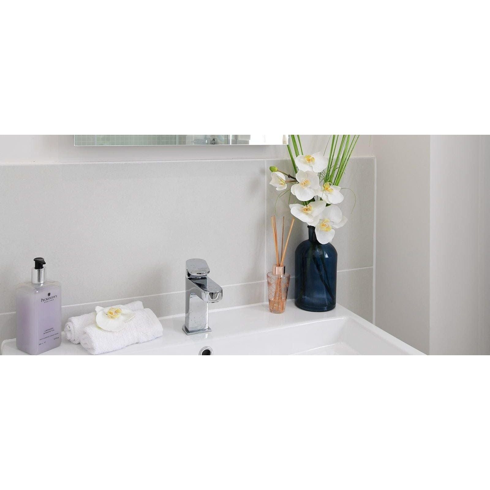 Select Bianco Matt 30 x 60cm white ceramic tiles with a chrome tap