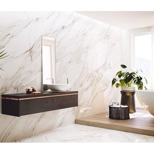 Serie Corinto Polished white marble-effect tiles with a dark wood vanity and vessel sink