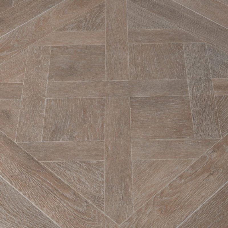 Versailles taupe gray wood-effect floor tiles arranged in a herringbone pattern for stylish flooring