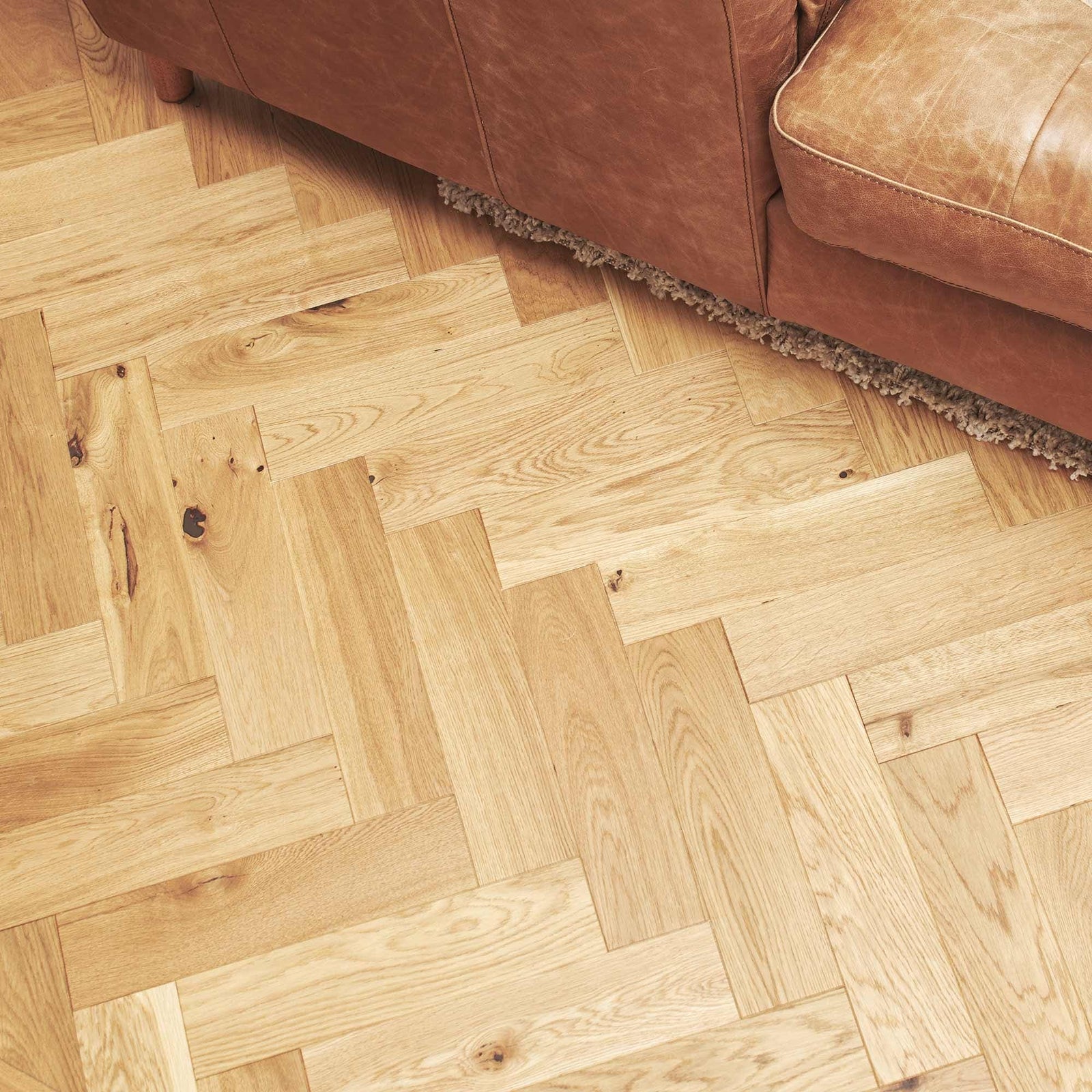 Light-colored oak hardwood floor with brushed matt finish in herringbone pattern zb109 brushed matt oak