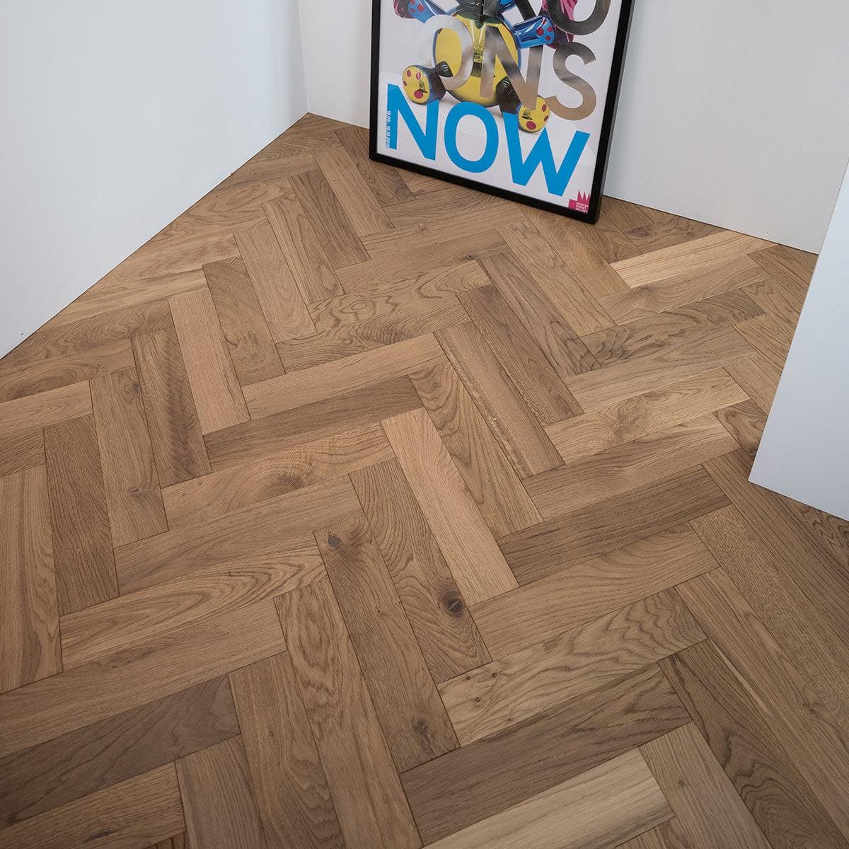 Light brown hardwood floor with herringbone pattern in zb203 white smoked oak for stylish interior flooring