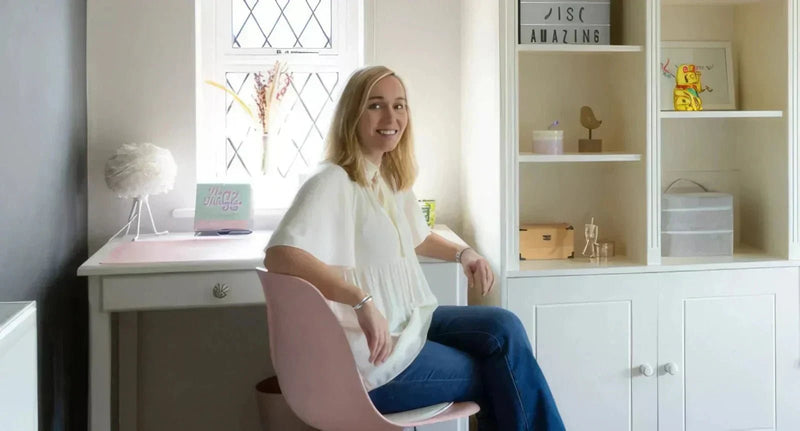 Pink modern fabric chair with a minimalist design perfect for a pre-teen bedroom makeover by finnteriordesign