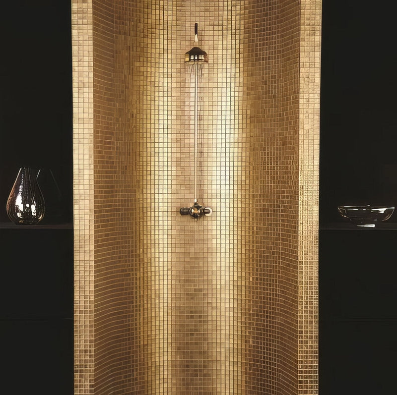 A sleek modern showerhead with polished brass finish and integrated rain-style spray head for luxurious bathroom decor