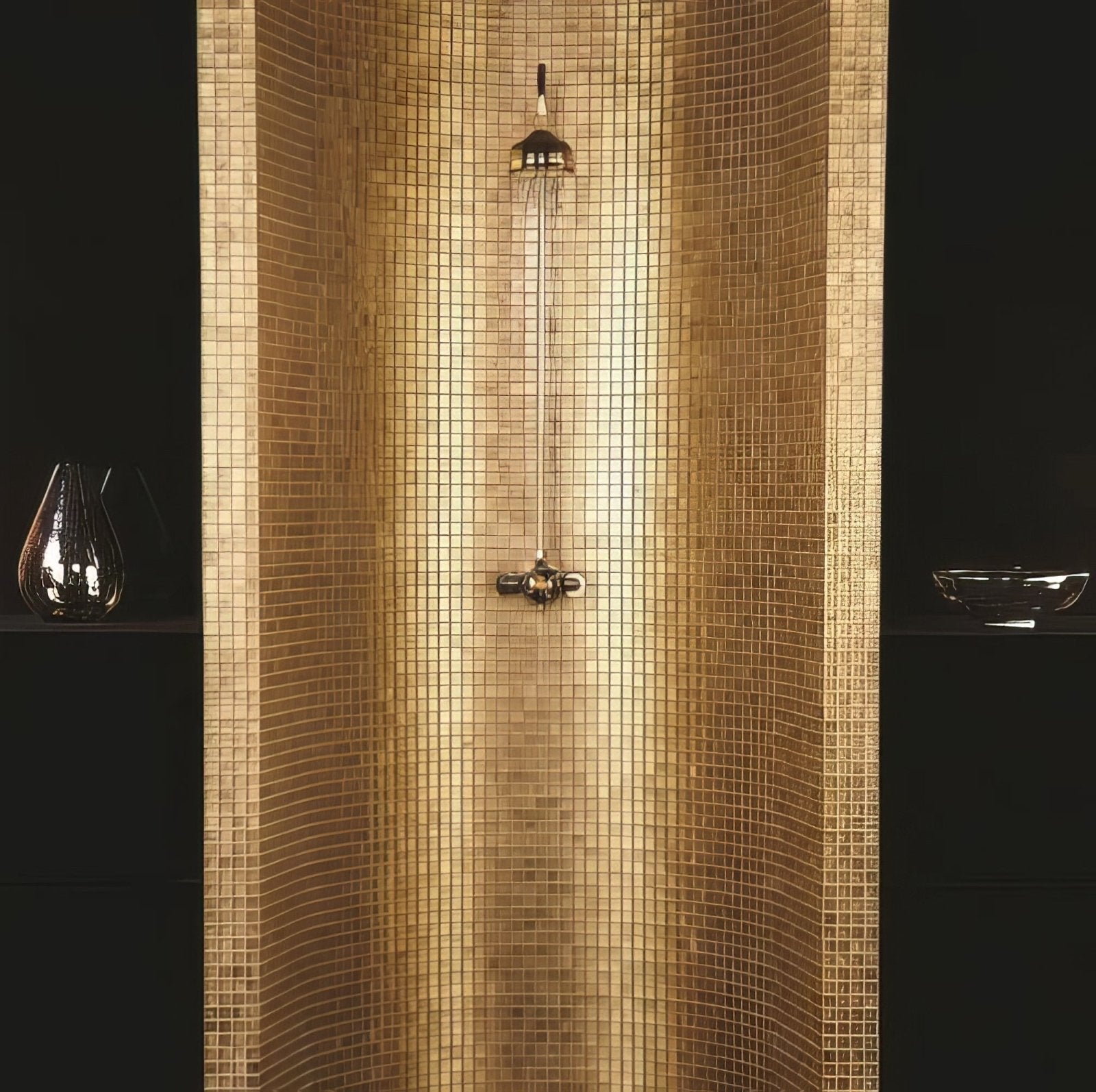 A sleek modern showerhead with polished brass finish and integrated rain-style spray head for luxurious bathroom decor