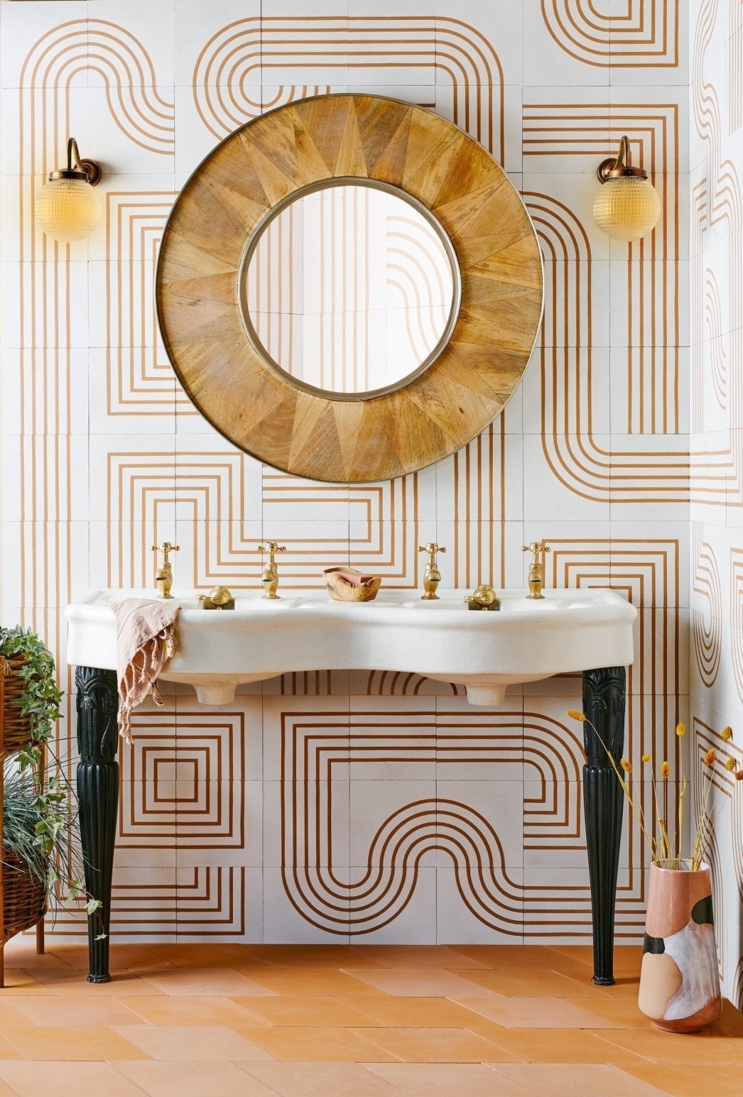 Circular wooden-framed mirror with sunburst pattern perfect for modern bathroom ideas for christmas and beyond