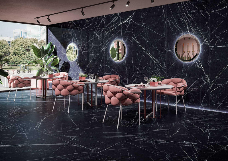 Pink tufted velvet chairs with slender metal legs complement modern wall panels for luxury interior updates