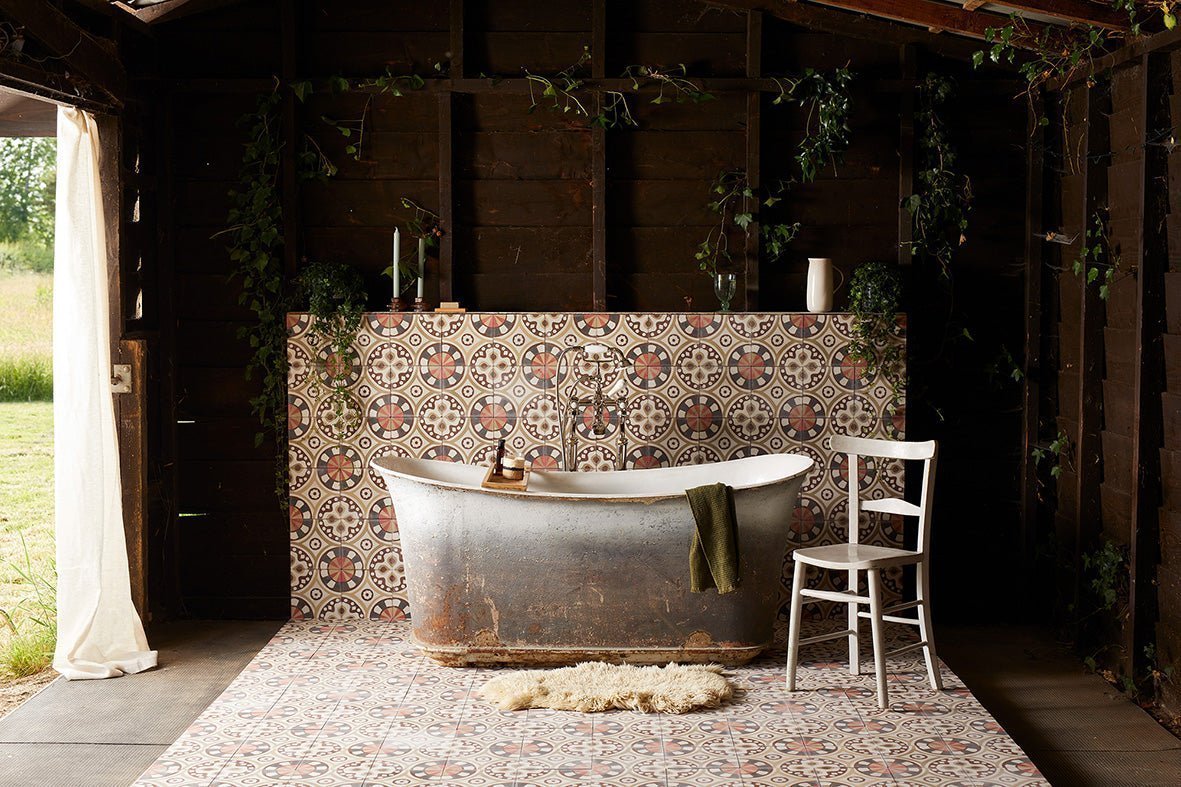 Antique-style freestanding bathtub with weathered metallic finish and rustic patina for stylish bathroom tiles article
