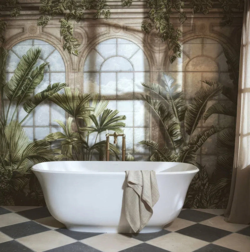 White freestanding bathtub with towel draped over side in the palm house collection for bathroom relaxation