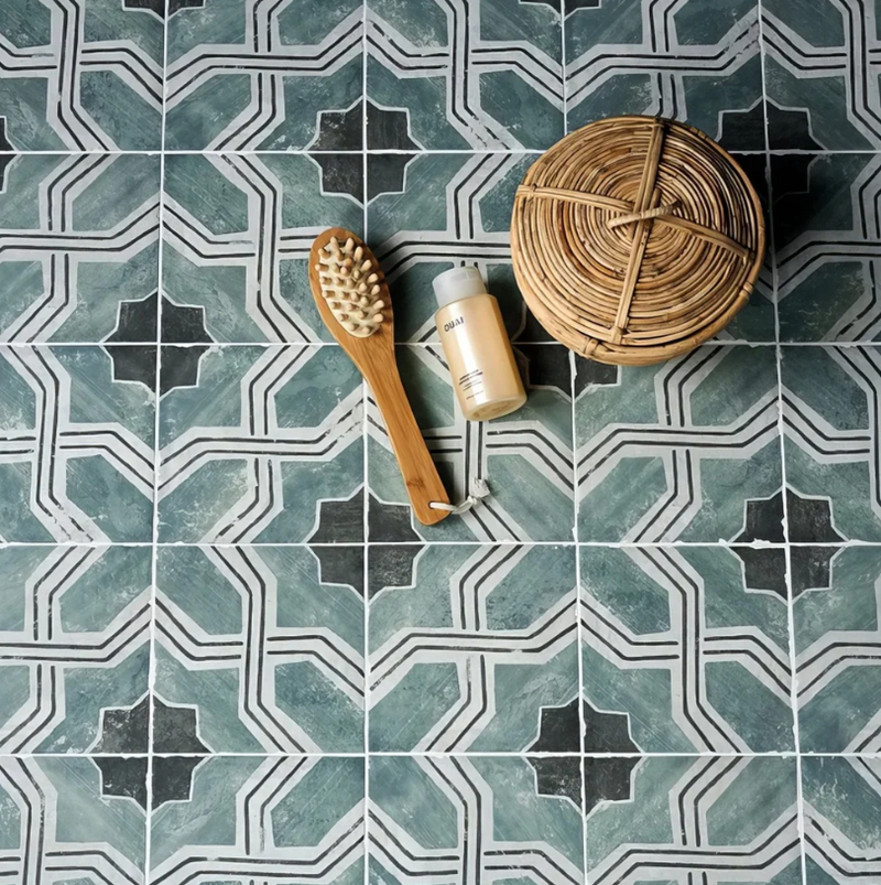 A natural wood-handled brush with light rounded bristles from the cuba porcelain collection