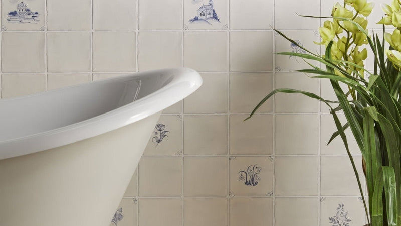 Cream-colored ceramic kitchen tiles with delicate blue floral and architectural motifs 13cm by 13cm