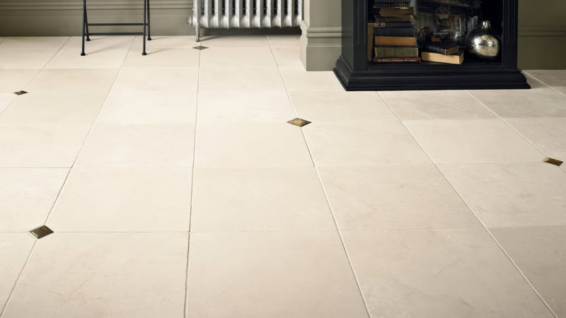 Cream-colored porcelain bathroom floor tiles with subtle gold diamond inlays in 40 x 40cm size
