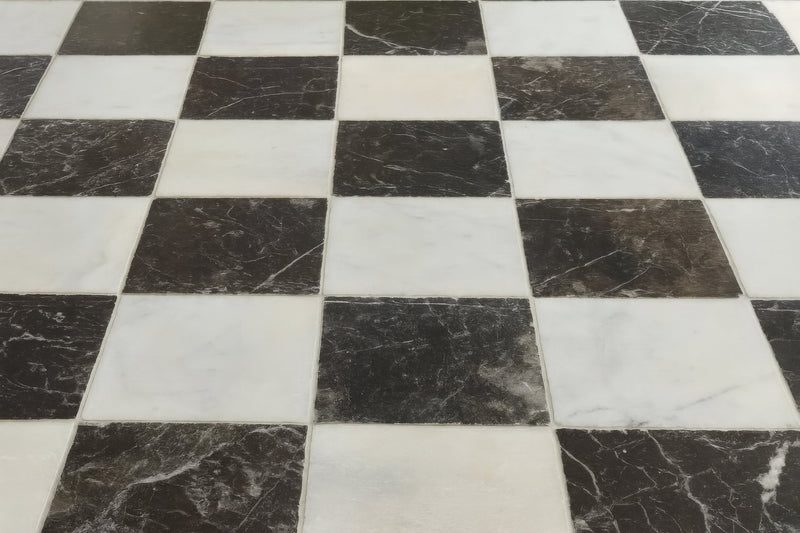 Black and white marble 40cm x 40cm floor tiles arranged in a classic checkerboard pattern for elegant flooring.