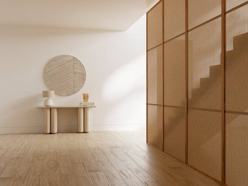 Circular wooden mirror with subtle grain pattern and light beige finish from the Aland collection