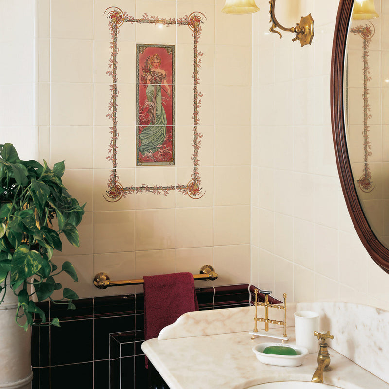 Art nouveau ceramic tile featuring a woman in an elegant green gown on red background with ornate gold leaf borders
