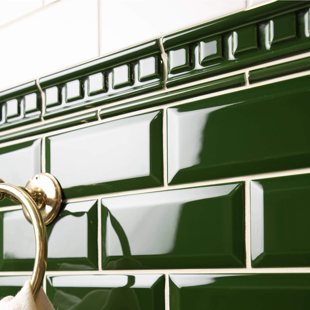 Deep green glossy ceramic subway tiles with raised rectangular border design from artworks dentil moulding collection