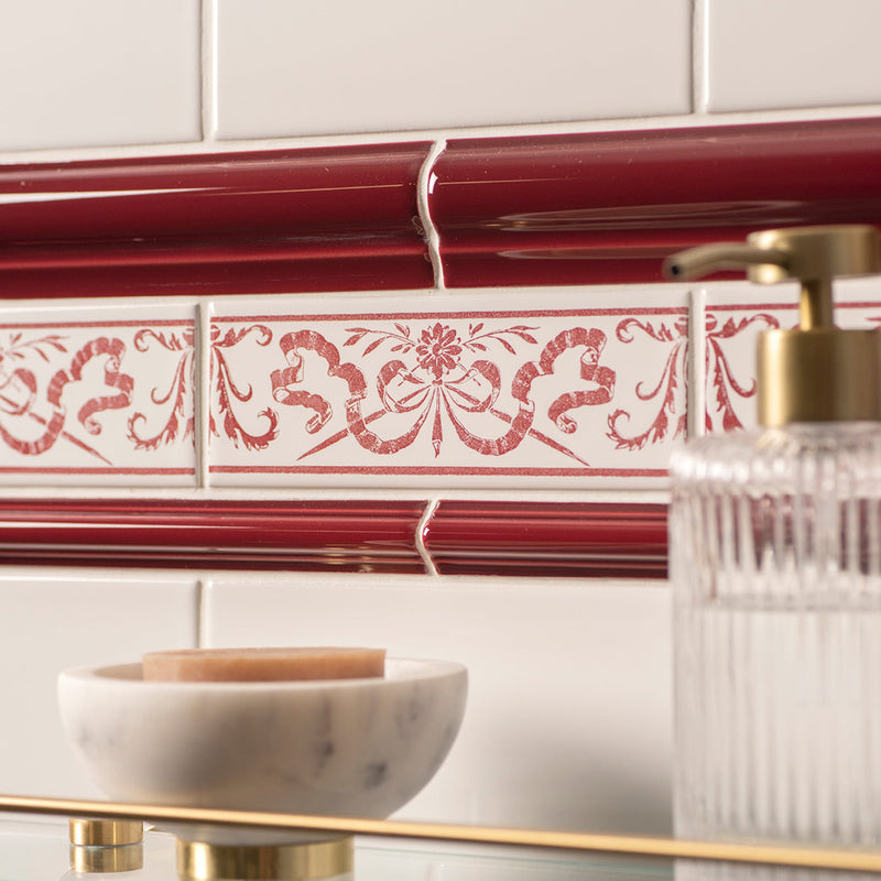 Red and white decorative tile with intricate floral and ribbon patterns from artworks love knot border collection