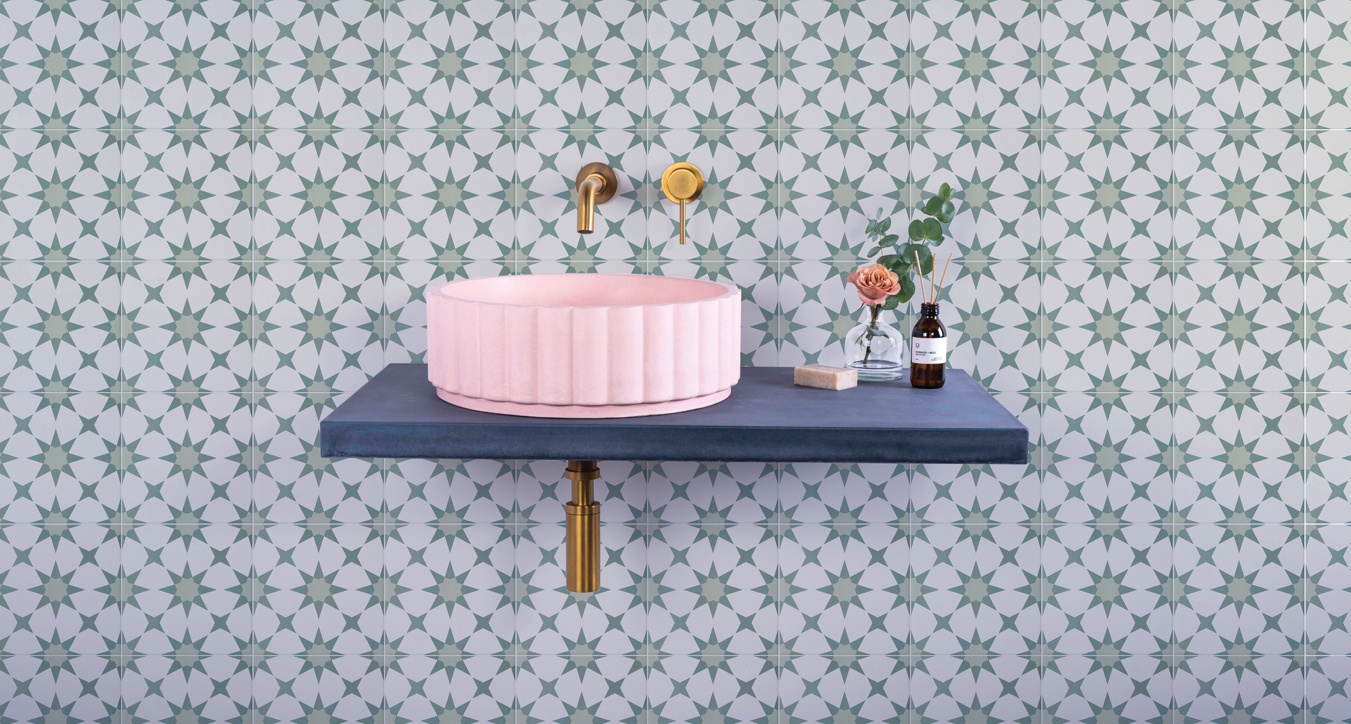 Pink ribbed ceramic vessel sink from the atlas porcelain collection for bathroom use