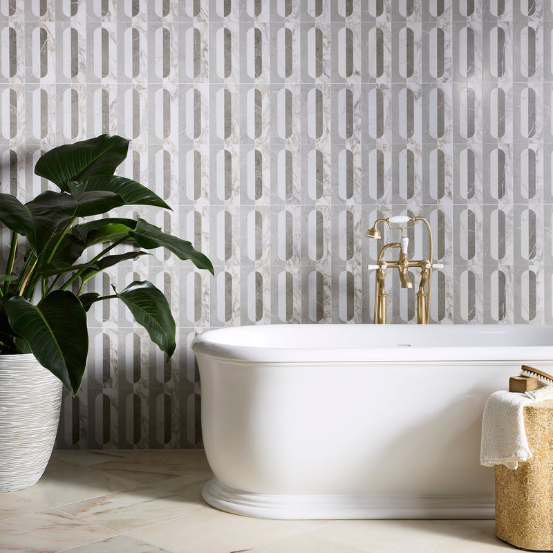 White freestanding porcelain bathtub with gold-toned faucet and fixtures in the byzantine porcelain collection