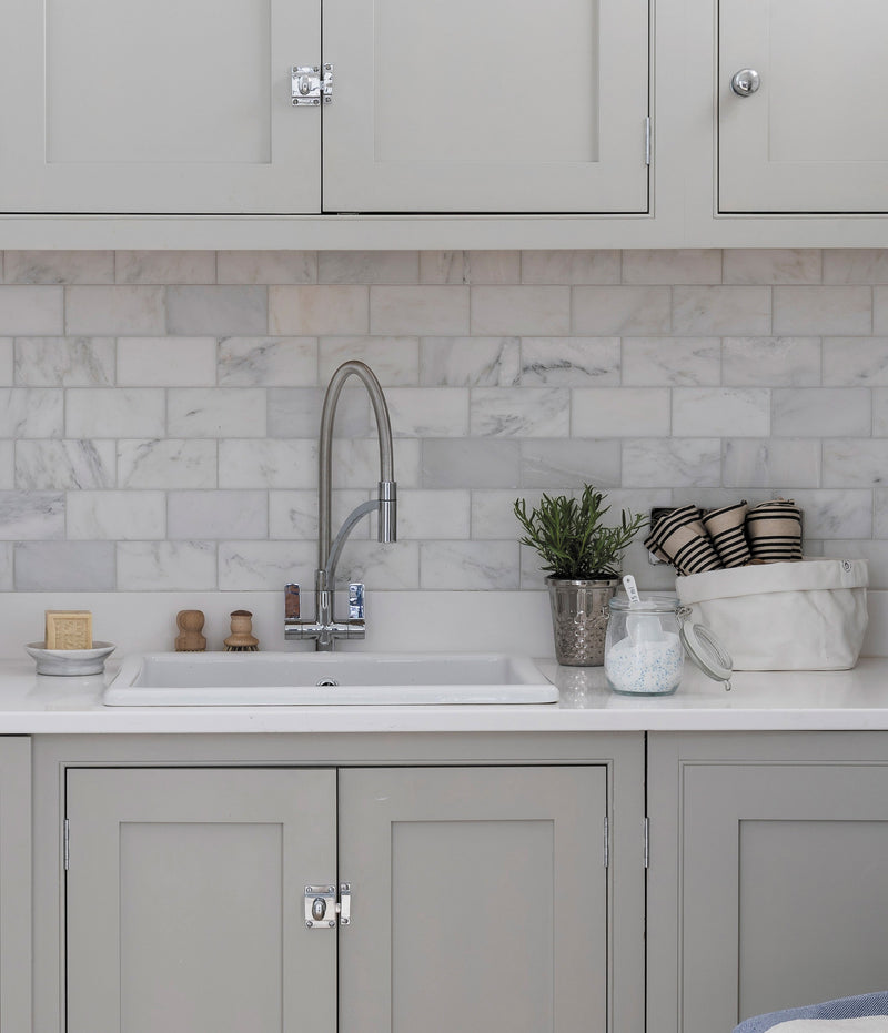 Silver gooseneck faucet with sleek modern design in long island marble collection for kitchen or bathroom use