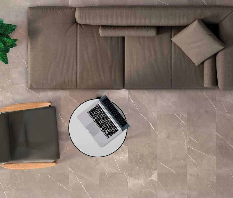 Gray upholstered sectional sofa with matching throw pillows and cylindrical cushions from the energy stone collection