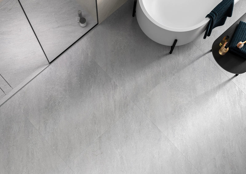 Gray concrete effect bathroom floor tiles with subtle veining and matte finish from klifface collection