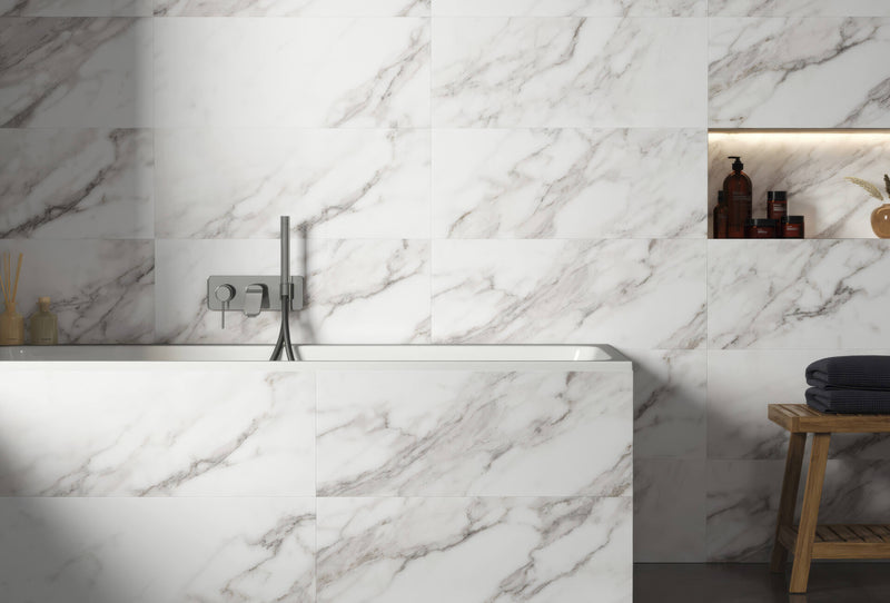White marble-effect bathroom tiles with subtle gray veining from the magnus collection ideal for wall or floor use