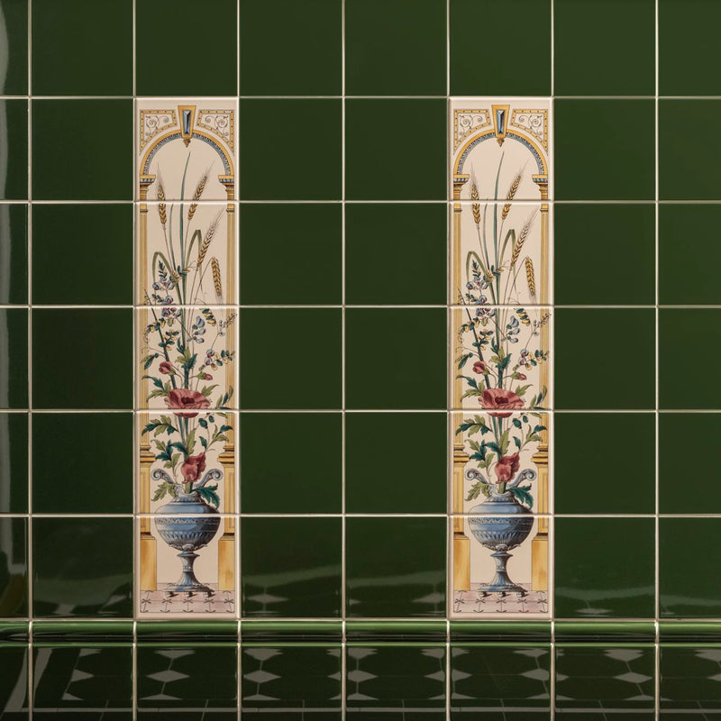 Two tall ceramic tiles with ornate gold arches and botanical illustrations in poppies floral decorative tile red on county white collection