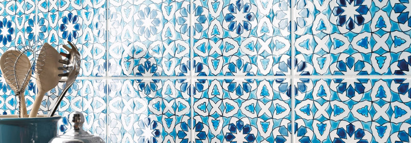 Blue and white patterned ceramic tiles with intricate floral designs from the andalucia glazed wall tiles collection