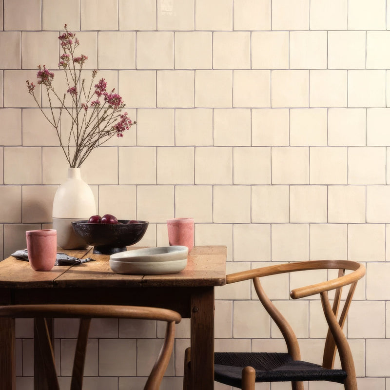 Cream-colored ceramic tiles with subtle matte finish arranged in a neat grid pattern from arcadian field tile collection