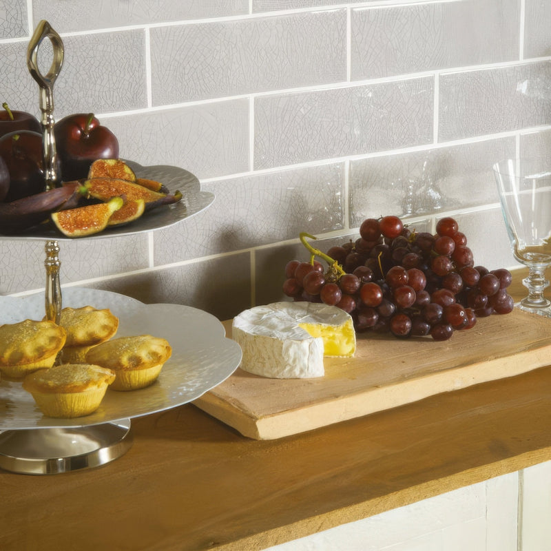 Silver two-tiered serving stand with ornate handles and reflective metallic finish from artisan 225mm crackle brick collection