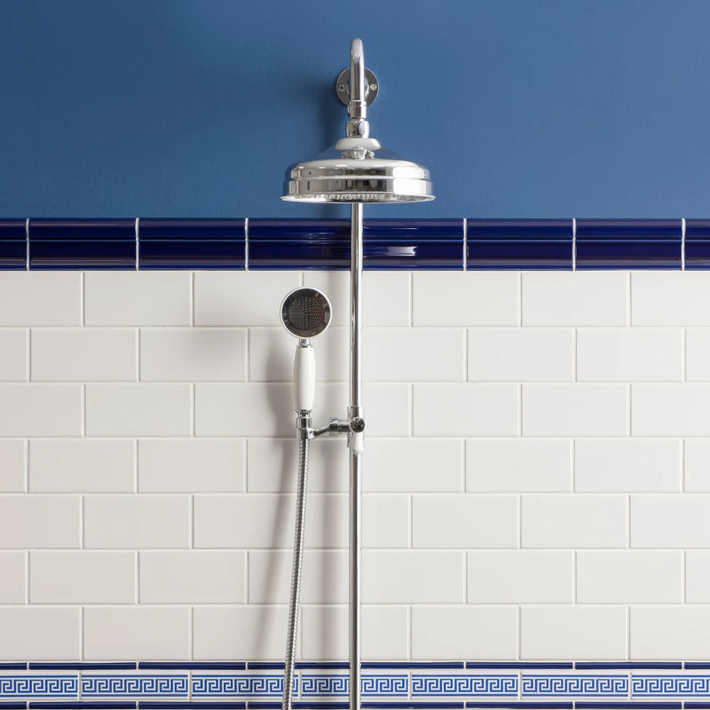 Chrome finished showerhead with sleek rounded design and matching handheld nozzle from artworks brilliant white collection