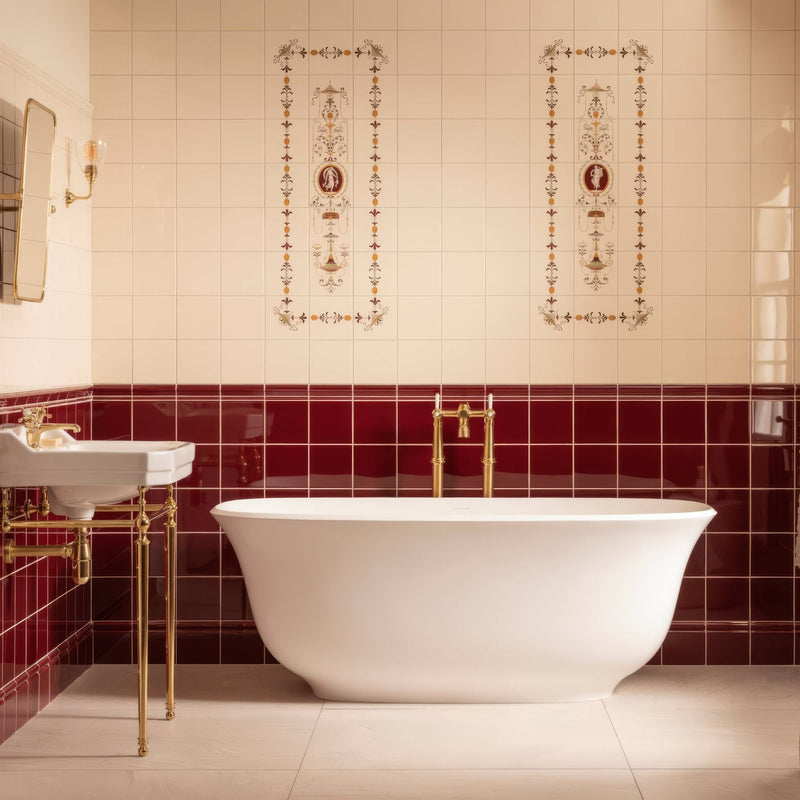 White freestanding bathtub with gold fixtures and glossy red tile accent wall from the artworks burgundy collection