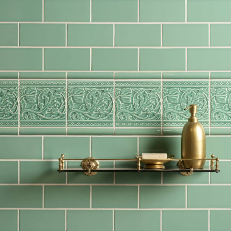 Gold soap dispenser with sleek rounded body and pump top from the artworks jade breeze collection