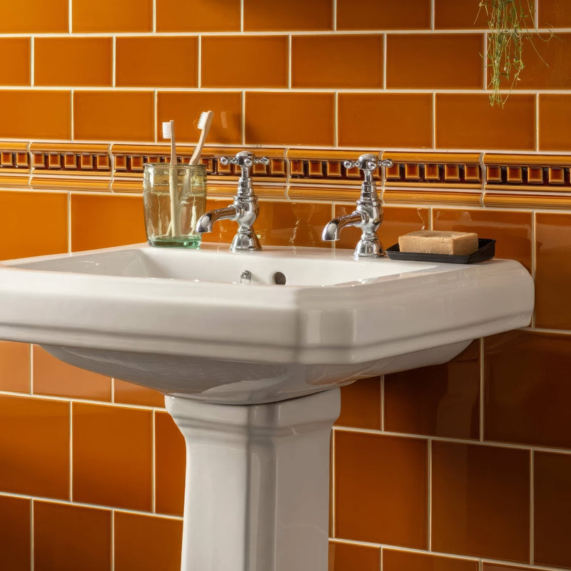 White ceramic pedestal sink with chrome faucets from artworks ochre collection for bathroom use