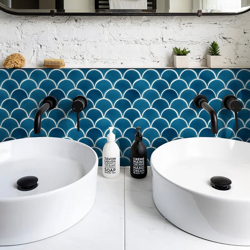 White ceramic vessel sinks with black matte faucets and stoppers in the Atlantis porcelain mosaic collection