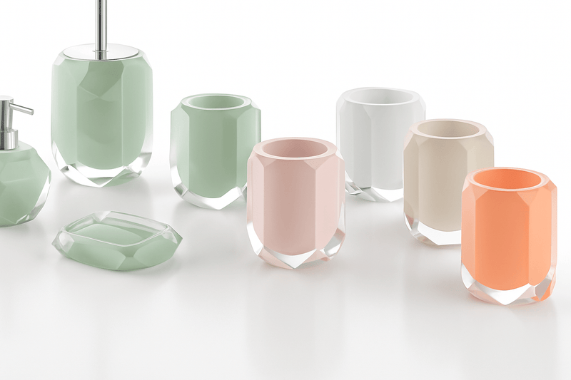 Set of pastel-colored faceted glass bathroom accessories with modern geometric design for bathroom use