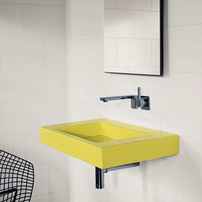 Bright yellow rectangular wall-mounted sink with sleek chrome faucet in bilbao white tiles collection