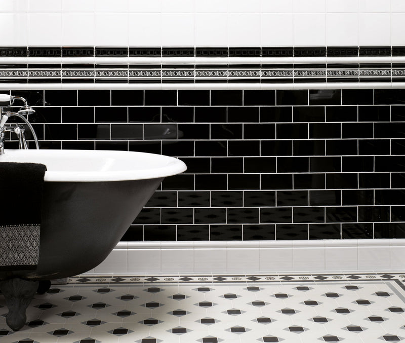 Black and white subway tile backsplash with decorative greek key border in ceramic for kitchen walls