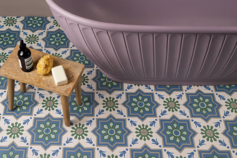 Lavender-colored bathtub with vertical ribbed detailing featured in a blue bathroom tiles collection