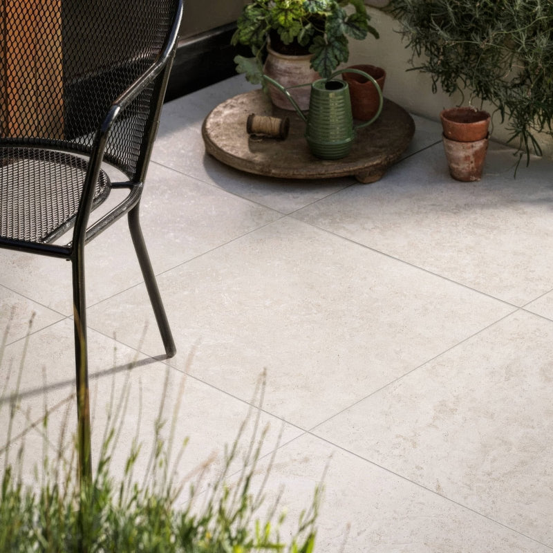 Light gray stone-effect porcelain patio tiles with subtle veining and matte finish from burlington porcelain tiles collection