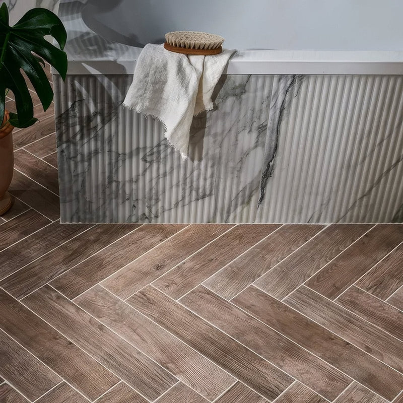 Gray and white marble-patterned porcelain bathtub with vertical ribbed texture from chatham porcelain collection