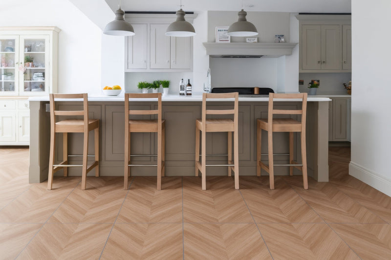 Light brown herringbone patterned wooden floor tiles from the chevron floor tiles collection for stylish interiors.