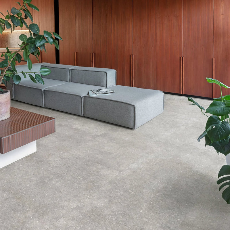 Modern gray modular sectional sofa with clean lines and minimalist design in concrete effect LVT rigid core collection.