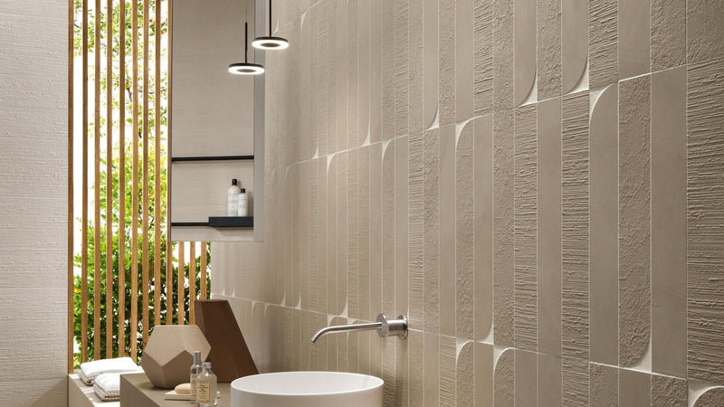 Beige concrete effect wall tiles with textured vertical raised geometric patterns for modern interiors