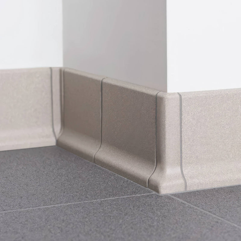 Beige textured plastic baseboard with subtle matte finish and modern profile from the Dorset Woolliscroft Fittings collection