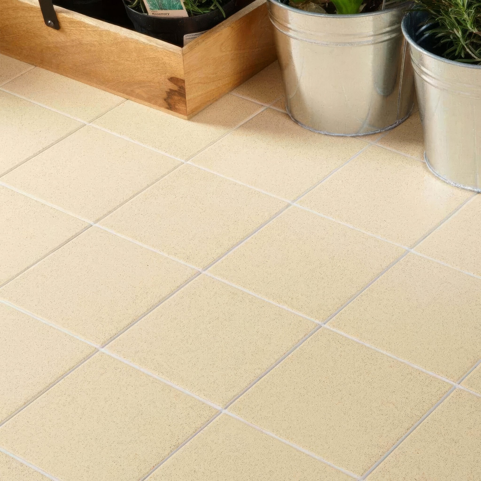 Beige square floor tiles from dorset woolliscroft flat collection with subtle textured finish and light gray grout lines