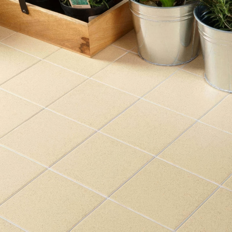 Beige square floor tiles from dorset woolliscroft flat collection with subtle textured finish and light gray grout lines